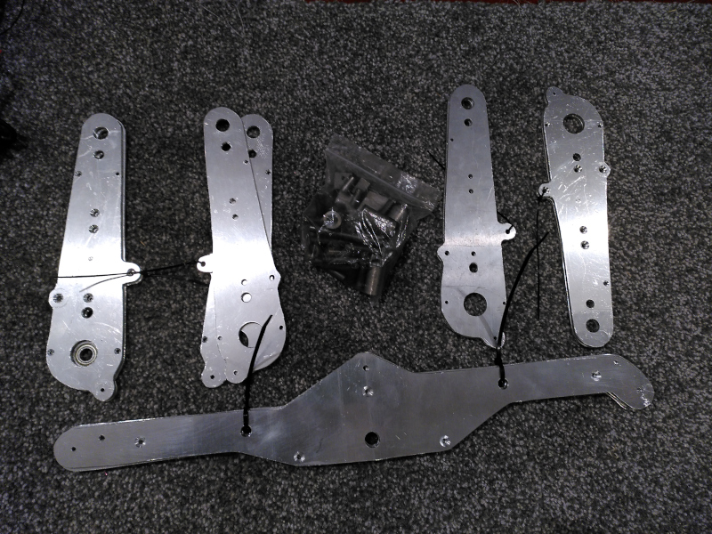 A selection of parts cut from sheet aluminium.