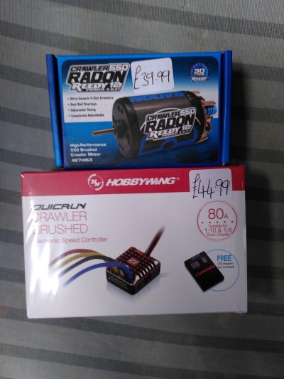 A boxed radio controlled car motor and a Hobby Wing electronic speed controller.